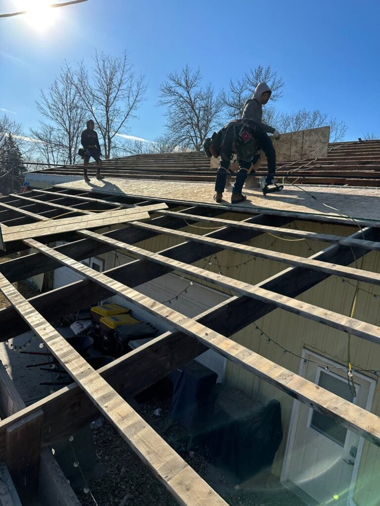 Crew working on big commercial roofing project for Minnesota local business