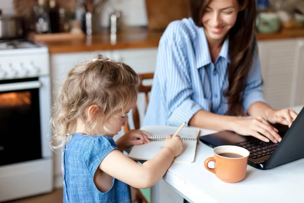 mother and daughter at kitchen table which looking at financing options
